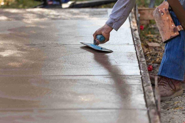 Newly installed concrete driveway with smooth finish and clean layout at residential home in Medina, OH